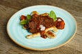 Cooked beef with vegetables on a wooden table Royalty Free Stock Photo