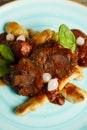 Cooked beef with vegetables on a wooden table Royalty Free Stock Photo