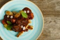 Cooked beef with vegetables on a wooden table Royalty Free Stock Photo