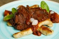 Cooked beef with vegetables on a wooden table Royalty Free Stock Photo