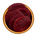 Cooked beetroot slices boiled sliced red beets in a wooden bowl