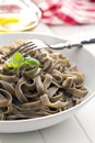Cooked black tagliatelle pasta Royalty Free Stock Photo