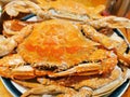 Cooked blue swimmer crabs on a plate
