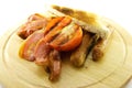 Cooked Breakfast Items on a Wooden Plate Royalty Free Stock Photo