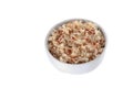 Cooked brown rice in cup on white background Royalty Free Stock Photo