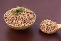 Cooked buckwheat. Healthy lunch. Brown background Royalty Free Stock Photo
