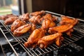 cooked buffalo wings on a cooling rack