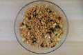 Cooked bulgur with raisins, apples, cinnamon and sugar. Sweet bulgur porridge, vegetarian food.