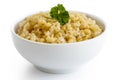 Cooked bulgur wheat with green parsley in white ceramic bowl iso