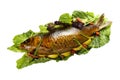 Cooked carp on lettuce leaves.