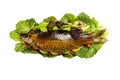 Cooked carp on lettuce leaves.