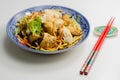 Cooked chicken breast pieces with savory garlic and ginger soy sauce and noodles, black fungus mushrooms, savoy cabbage, and