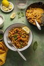 Cooked Chickpea dish with curry and spices, homemade vegan chickpeas, healthy food, colorful green background Royalty Free Stock Photo