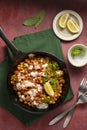 Cooked chickpea in frying pan with curry and spices, homemade vegan chickpeas, healthy food, colorful background Royalty Free Stock Photo