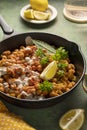 Cooked Chickpea in frying pan with curry and spices, homemade vegan chickpeas, healthy food, colorful green background Royalty Free Stock Photo