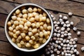 Cooked chickpeas in brown ceramic bowl.