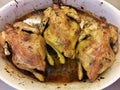 Cooked chikens in a clay pot