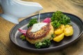 Cooked cod fish cutlet with potatoes, lettuce Royalty Free Stock Photo