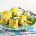 Cooked corn with herb butter Royalty Free Stock Photo