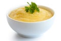 Cooked cornmeal polenta with green parsley in white ceramic bowl Royalty Free Stock Photo