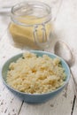 Cooked couscous in a blue bowl