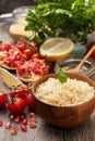 Cooked couscous, fresh vegetables for salad