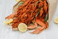 Cooked crawfish and crab claws close-up lie on a white wooden table Royalty Free Stock Photo