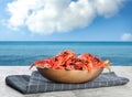 Cooked crayfishes served on grey table near sea Royalty Free Stock Photo