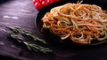 Cooked dish at home in the restaurant the chef decorates the finished pasta dish with grated Parmesan cheese on a kitchen grater