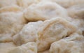 Cooked dishes of national Ukrainian kitchen- dumplings with butter. Royalty Free Stock Photo