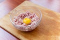 Cooked fresh mince for dish with raw egg lie in a plate