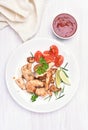 Cooked fried chicken fillet and vegetable salad