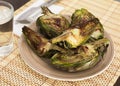 cooked fried halves artichokes on brown plate Royalty Free Stock Photo