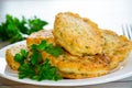 cooked fried potato cutlets with herbs