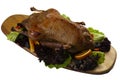 Cooked goose on a wooden board.