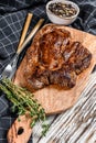 Cooked grilled Chuck eye roll steak on a chopping Board. White background. Top view Royalty Free Stock Photo