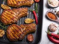 Cooked grilled steak meat pork, beef, lamb, chop on a bone, on grill pan, close up Royalty Free Stock Photo