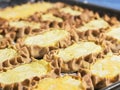 Cooked Karelian pies on a baking sheet. Dish of national cuisine - piirakka. Close-up Royalty Free Stock Photo