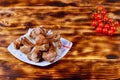 Cooked kebabs with vegetables and spices on wooden board Royalty Free Stock Photo