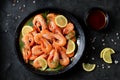 Cooked large shrimps with lemon, dill and tomato sauce. Healthy food. Top view. Royalty Free Stock Photo