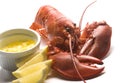 Cooked lobster with butter and lemon wedges Royalty Free Stock Photo