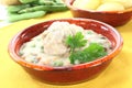 Cooked meatballs in a white sauce with capers