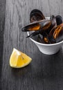 Cooked mussels in a bowl with lemon Royalty Free Stock Photo