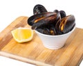 Cooked mussels in a bowl with lemon Royalty Free Stock Photo