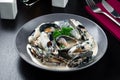 Cooked mussels in cream sauce appetizer for wine. Sea products. Mussel shop