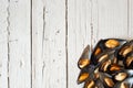 Cooked mussels on white wooden background, flay lay