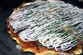 Cooked Okonomiyaki on hotplate