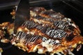 Cooked Okonomiyaki on hotplate