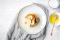 Cooked pancake on plate top view at wooden background