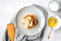 Cooked pancake on plate top view at wooden background Royalty Free Stock Photo